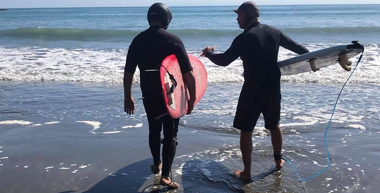 Gary and his mate surfing